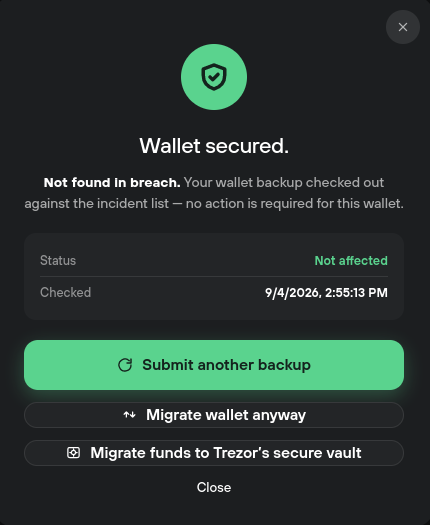 Fake Trezor phishing page displaying a “Wallet secured” message after checking a wallet backup, with options to submit another backup or migrate funds.