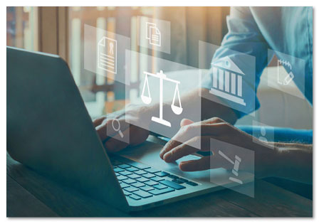 Person typing on a keyboard with legal icons floating in front of it including scales and a court building