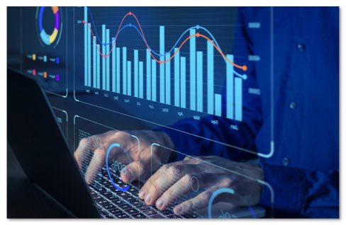 Bar graph monitor screen projected in front of hands typing on a laptop