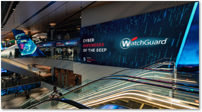 WatchGuard logo on a wall next to an escalator