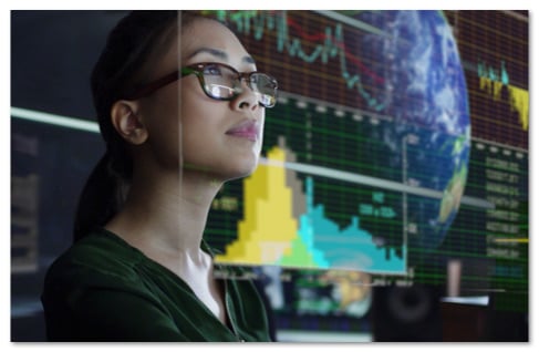 Woman in glasses with a screen graph floating in front of her