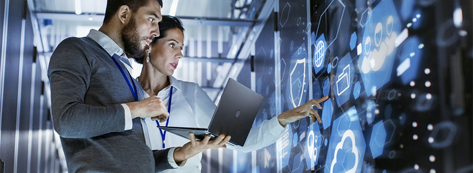 Man and a woman in a futuristic server room