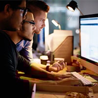 Photo: Computer users at a monitor