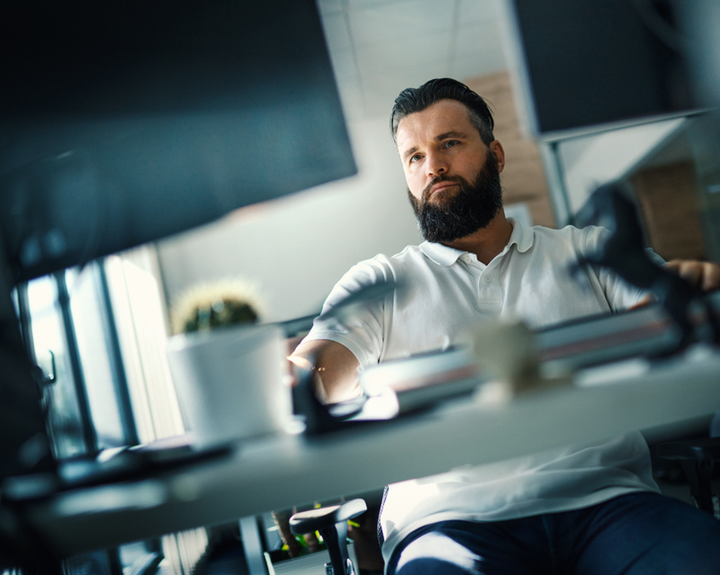 Bearded man in an office