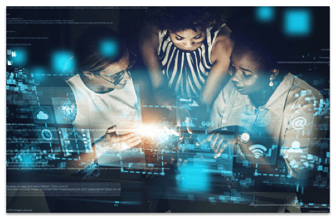 3 women with their heads together looking at a computer screen with bright blue screen graphics overlaid on top