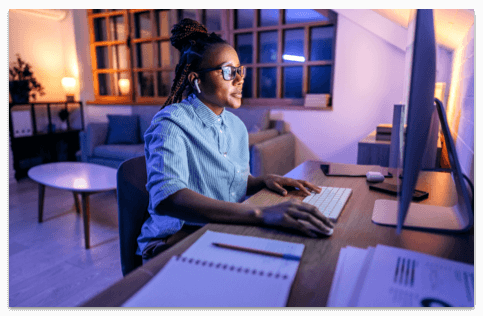 Woman with glasses working in a spacious home office