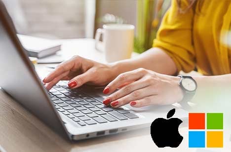 Woman with red fingernails typing on a laptop with Apple and Windows logos in the bottom right corner