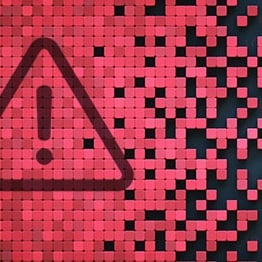Black alert triangle on a red tiled background