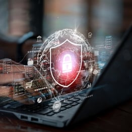 Cybersecurity lock and shield graphic over a laptop, symbolizing how MSPs help APAC businesses strengthen cyber resilience against modern threats.
