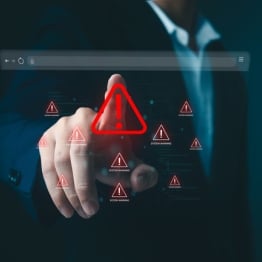 Business professional interacting with a digital browser interface displaying cybersecurity warning alerts, representing malware and compromised website threats.