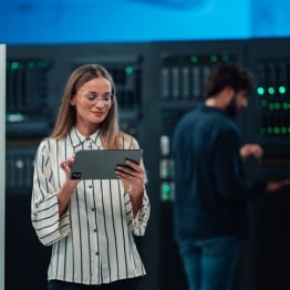 BLOG_IMAGE_ woman maintaining cloud computing database on digital tablet.jpg