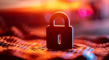 Close-Up of a Secure Lock over Blurred Digital Background in Warm Colors