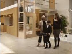 People walking through a modern lobby
