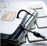 Stack of credit cards with a fish hook sticking through the top one