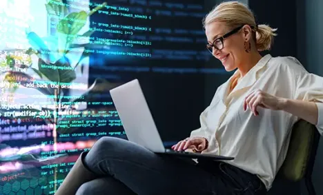 blond woman with a laptop