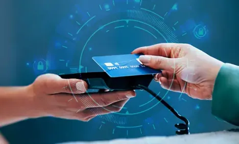 person tapping a credit card on a remote reader device