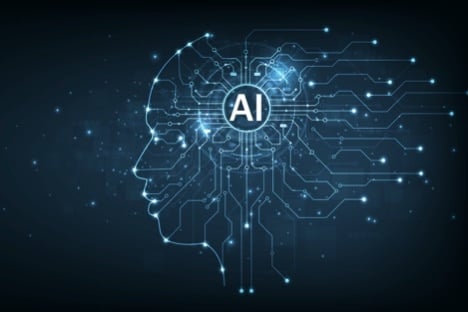 profile of a face made out of circuit board patterns with AI in a circle in the brain region