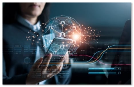 Hand holding a phone with a lit up globe surrounding it