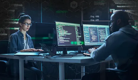 workers in a dark SOC room