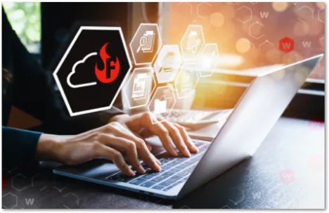 person typing on a laptop with a FireCloud logo between then and the machine