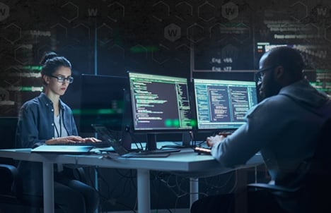 People working in a dark SOC 