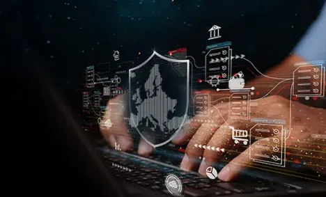 shield in front of hands on a keyboard