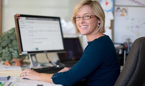 Blonde woman working in an office