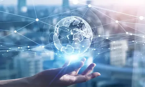 globe floating over an outstretched hand