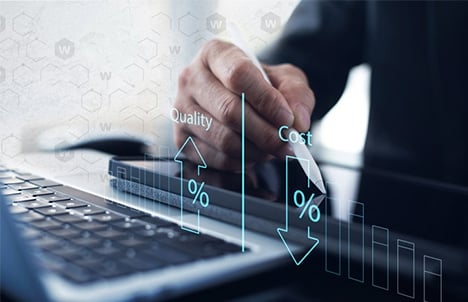 Hand holding a stylus over a tablet computer