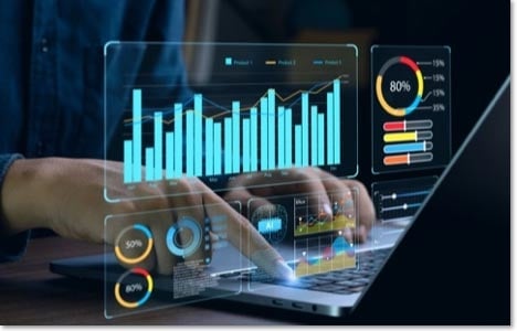 Graph floating in between a laptop screen and the user