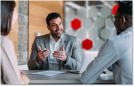 Workers around a table in an office setting