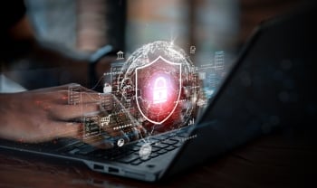 Cybersecurity lock and shield graphic over a laptop, symbolizing how MSPs help APAC businesses strengthen cyber resilience against modern threats.