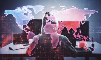 Hooded cyber threat actor in front of a global digital map representing Iran-linked cyber-espionage and geopolitical cyber risk.