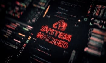 Dark cybersecurity interface displaying a glowing red “System Hacked” warning surrounded by blurred code and system data.