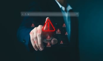 Business professional interacting with a digital browser interface displaying cybersecurity warning alerts, representing malware and compromised website threats.