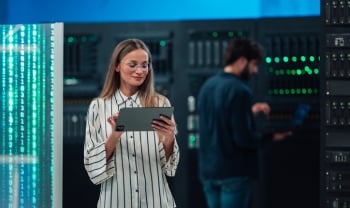 BLOG_IMAGE_ woman maintaining cloud computing database on digital tablet.jpg