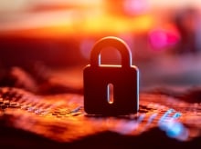 Close-Up of a Secure Lock over Blurred Digital Background in Warm Colors