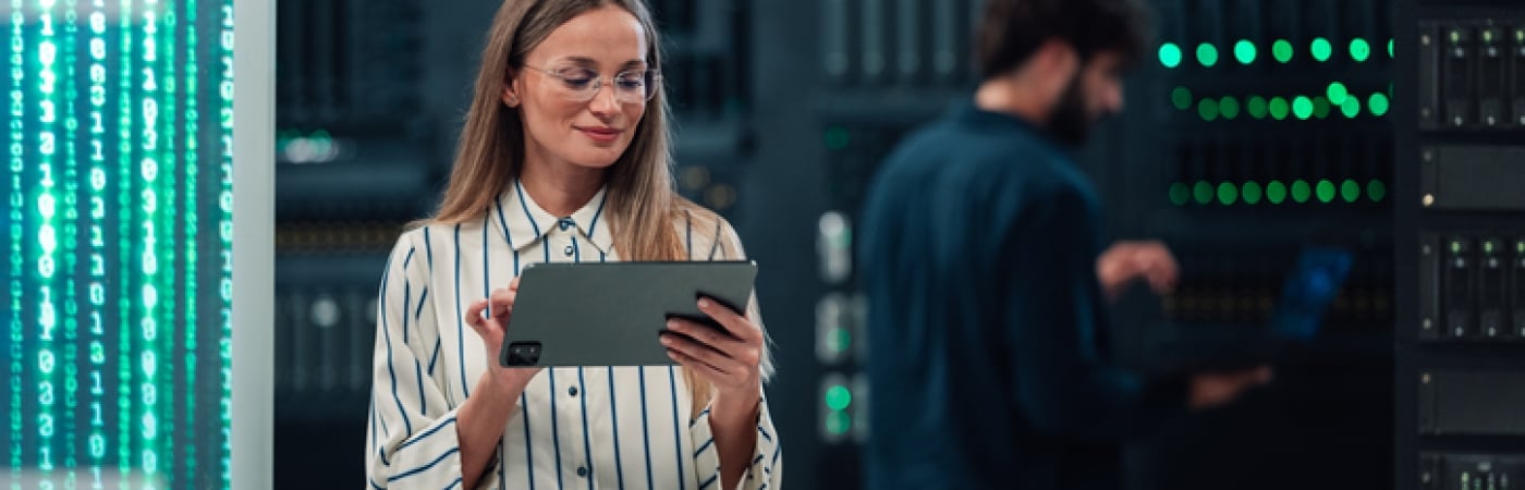 BLOG_IMAGE_ woman maintaining cloud computing database on digital tablet.jpg