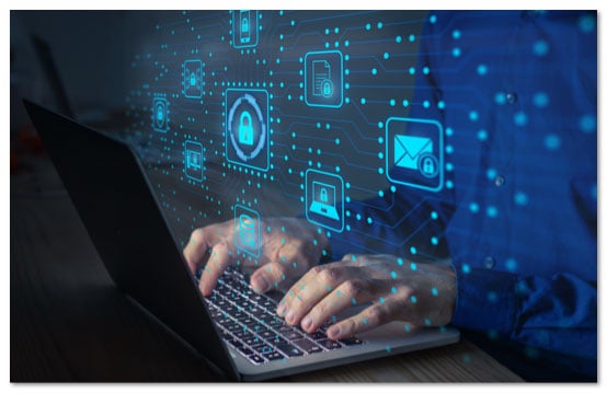 Hands on a laptop keyboard with glowing blue icons projected in front of the screen